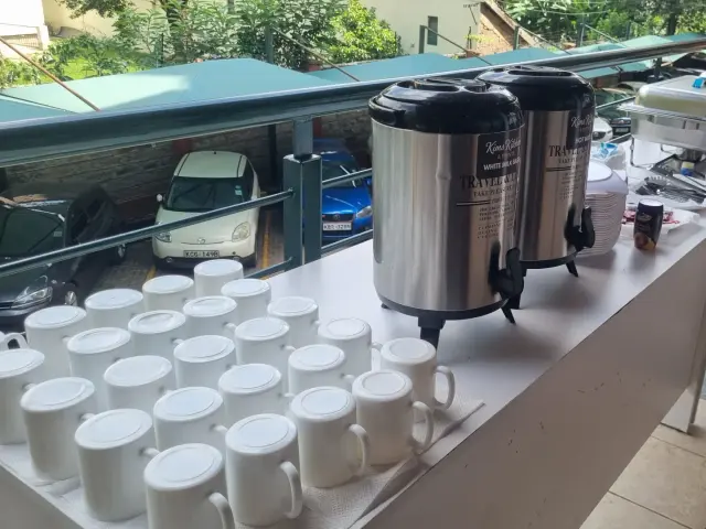 Professional boardroom tea and coffee setup for diplomatic embassy meeting in Nairobi