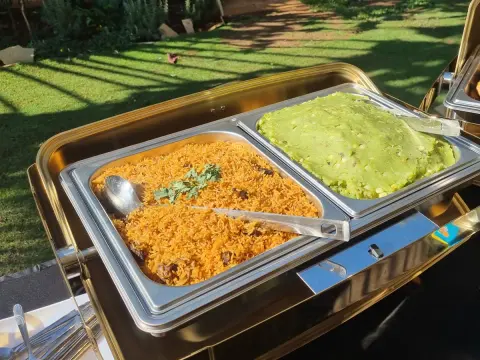 Kims Kitchen chefs preparing fresh buffet dishes under strict hygiene standards