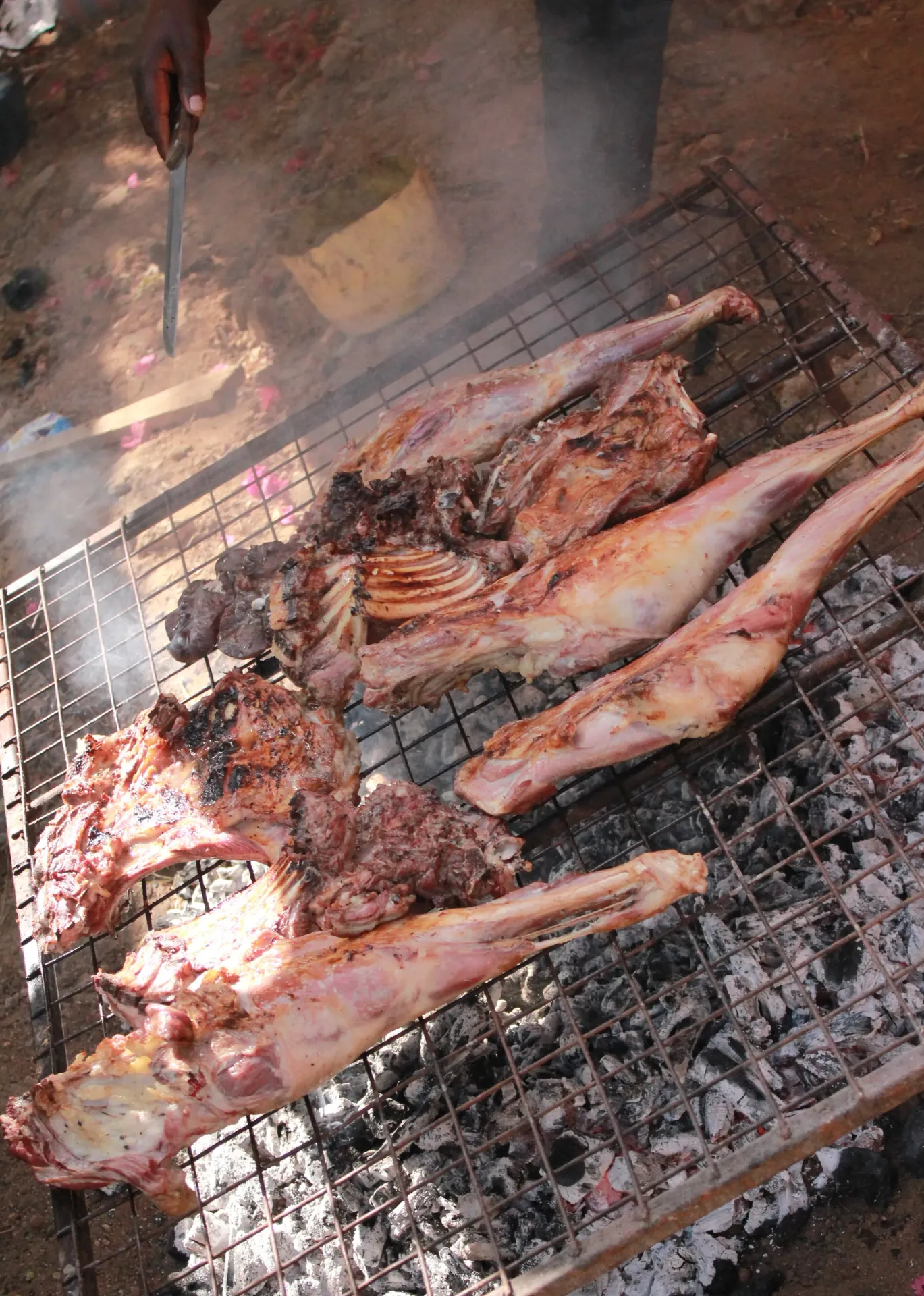 Live mbuzi nyama choma grilling station hosted by Kims Kitchen catering chefs at a private garden party in Karen Nairobi